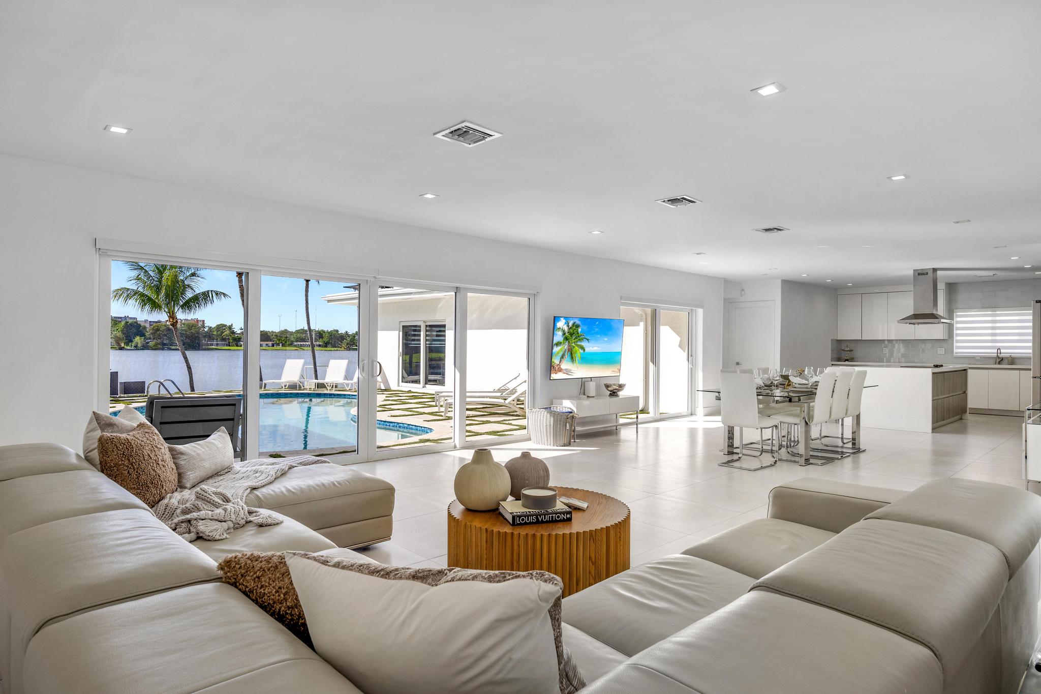 Modern  Miami Beach Lakeside Retreat with Sun-Soaked Yard
