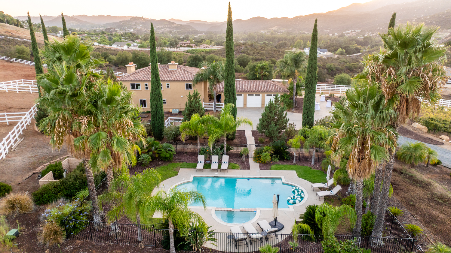 Pool terrace with palm trees and resort-style amenities