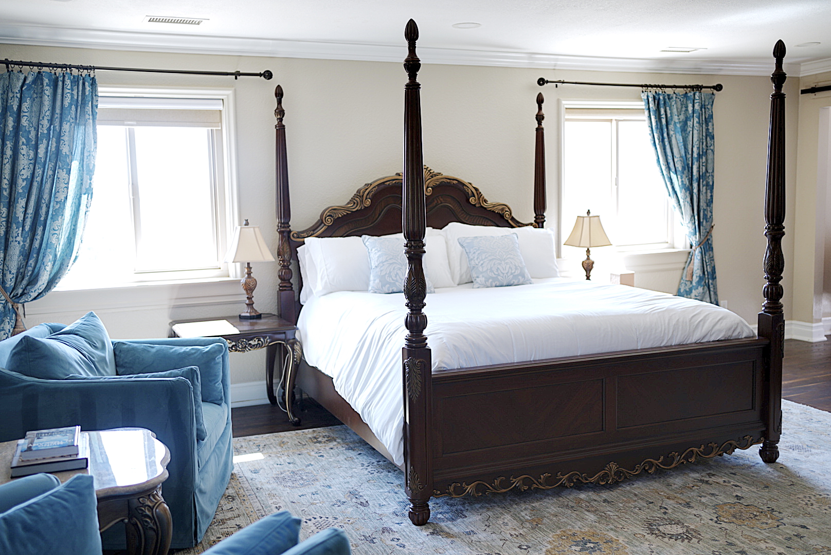 Primary bedroom suite with vineyard views and luxury bedding