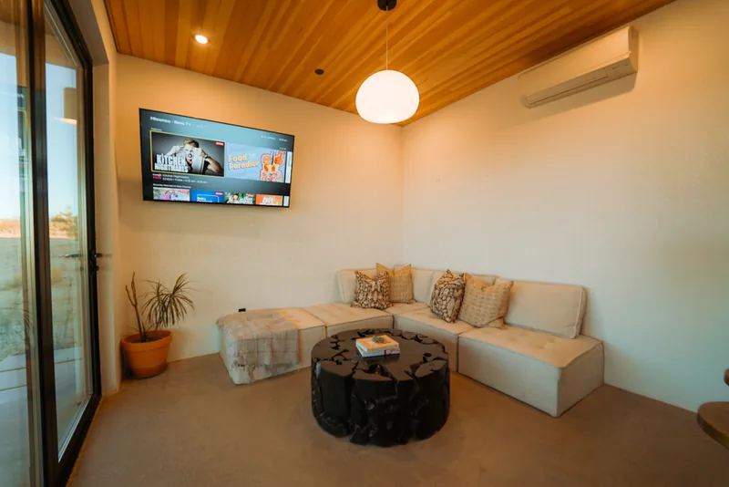 Modern interior with accordion glass doors and desert views
